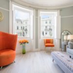 Lansdowne Place | Sitting Room with orange armchair and flowers